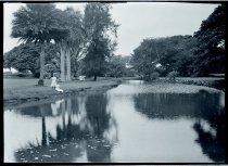 Two girls next to a stream, Moanalua Gardens, Oahu.